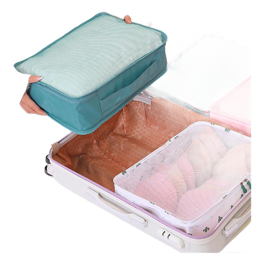 Accessoire de voyage, organiseur valise compressible, lot de trois, vue de trois quarts